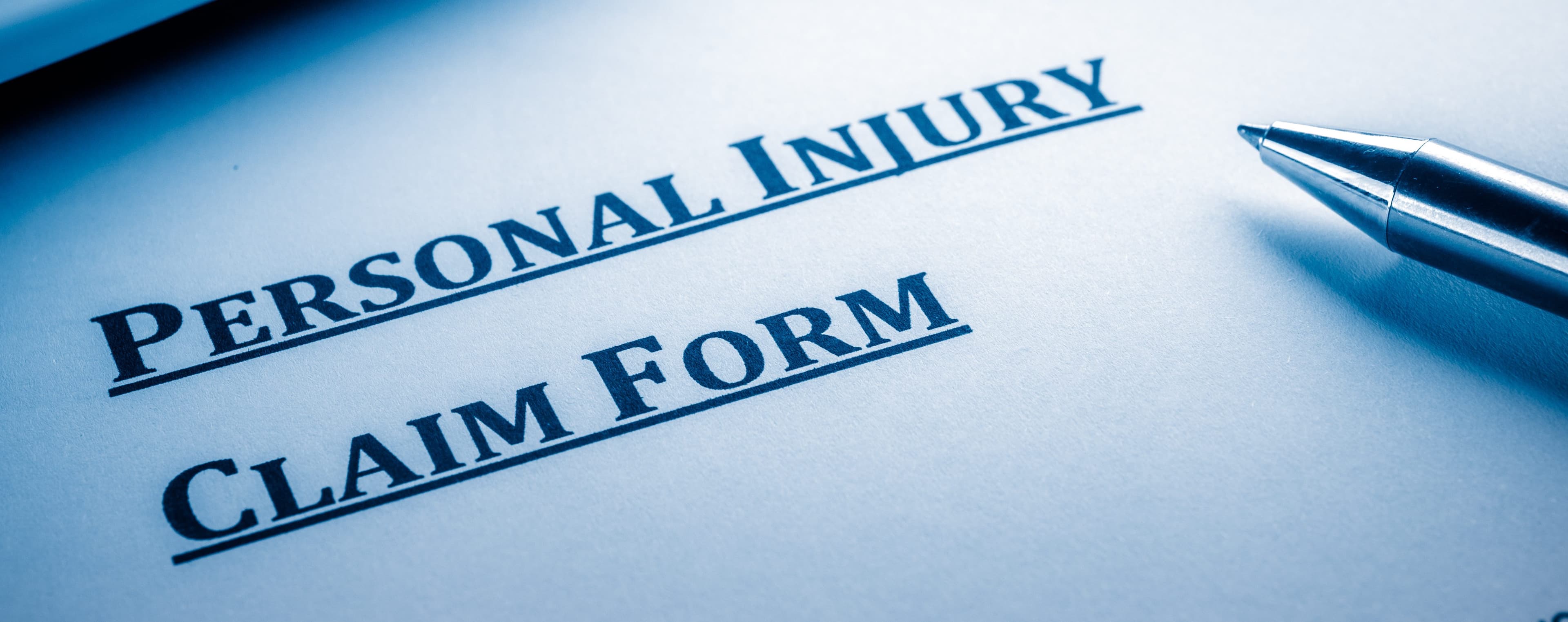 Personal injury claim form with pen | Personal Injury | The Sullivan Law Firm