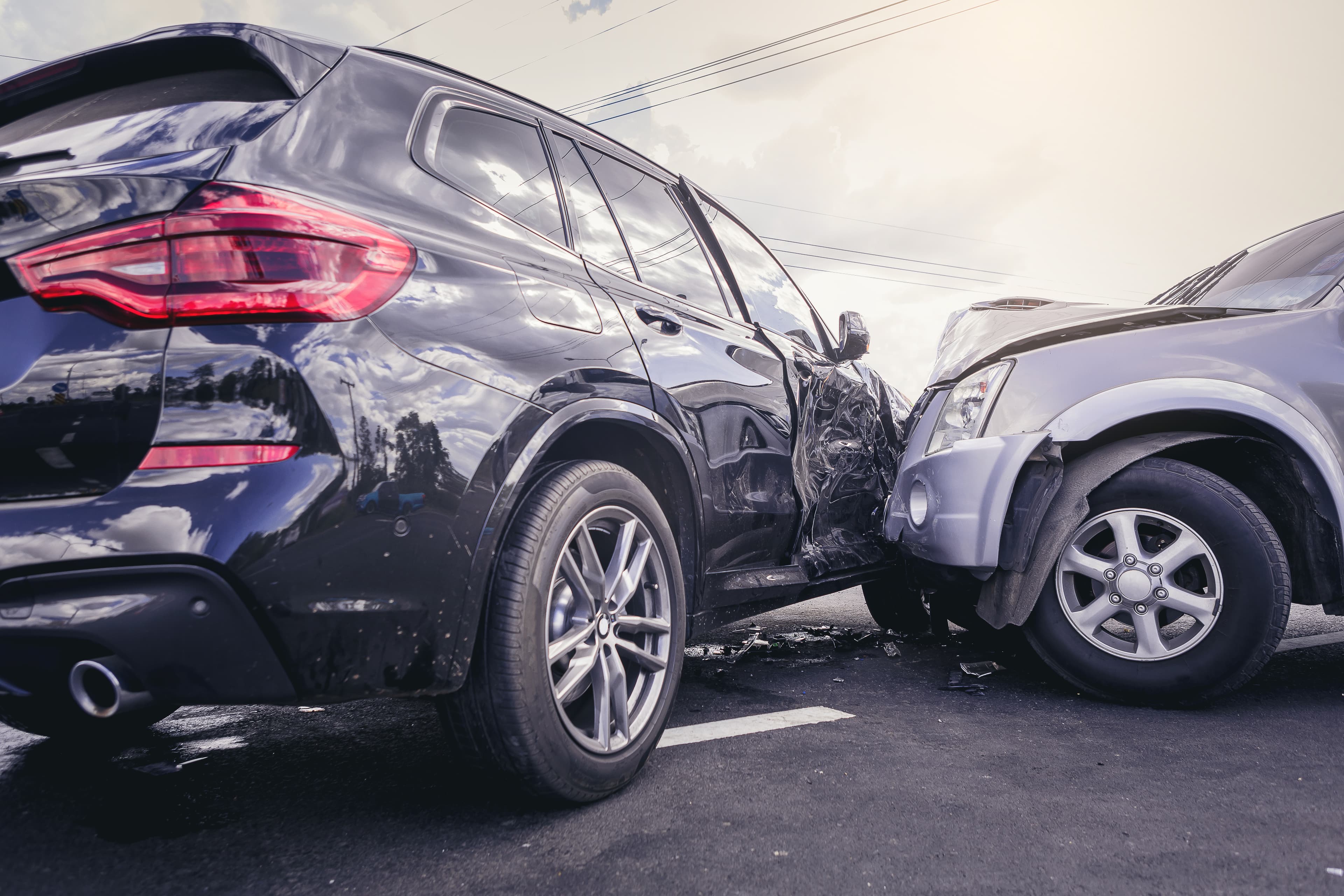 Two cars wrecked into each other with damage. | Personal Injury | The Sullivan Law Firm