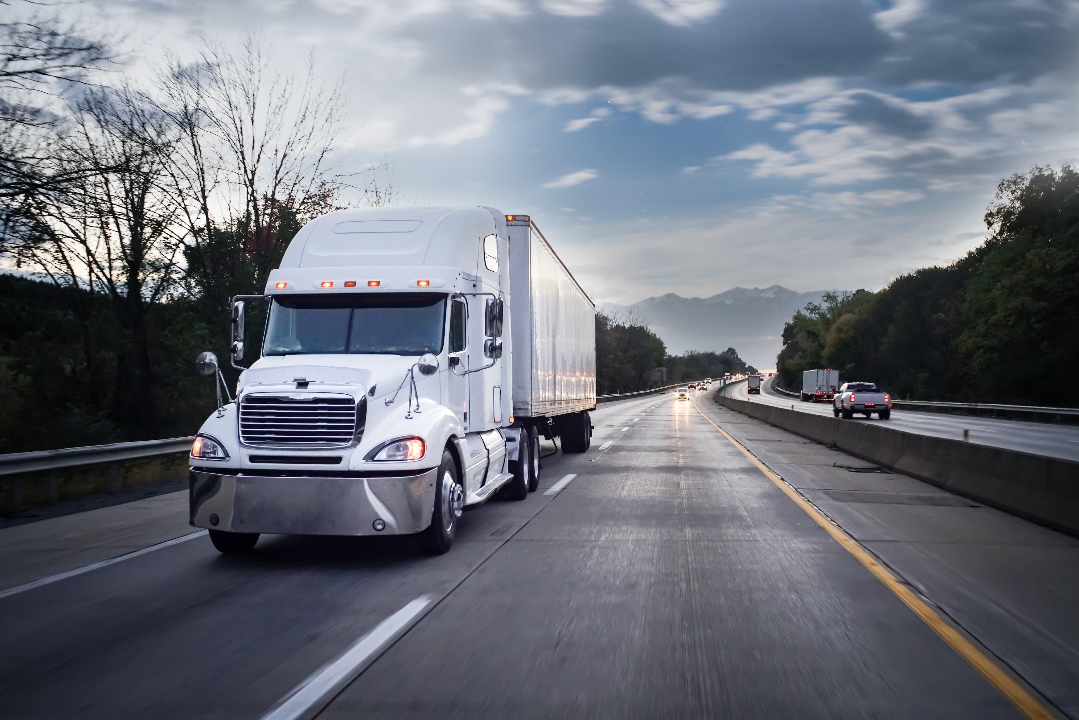 Semi truck driving on road | Personal Injury | The Sullivan Law Firm